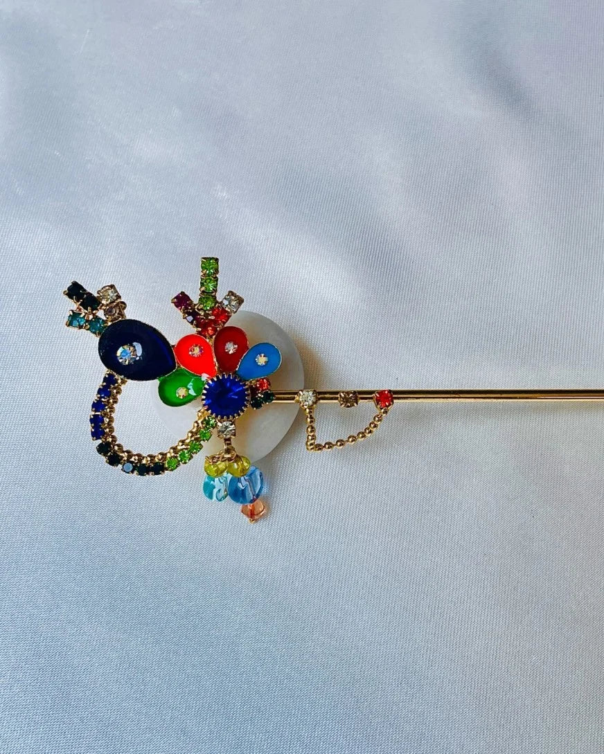 Multicolor crystal-studded Laddu Gopal Bansuri with hanging beads and chakra design – ideal flute for Kanha Ji’s shringar.