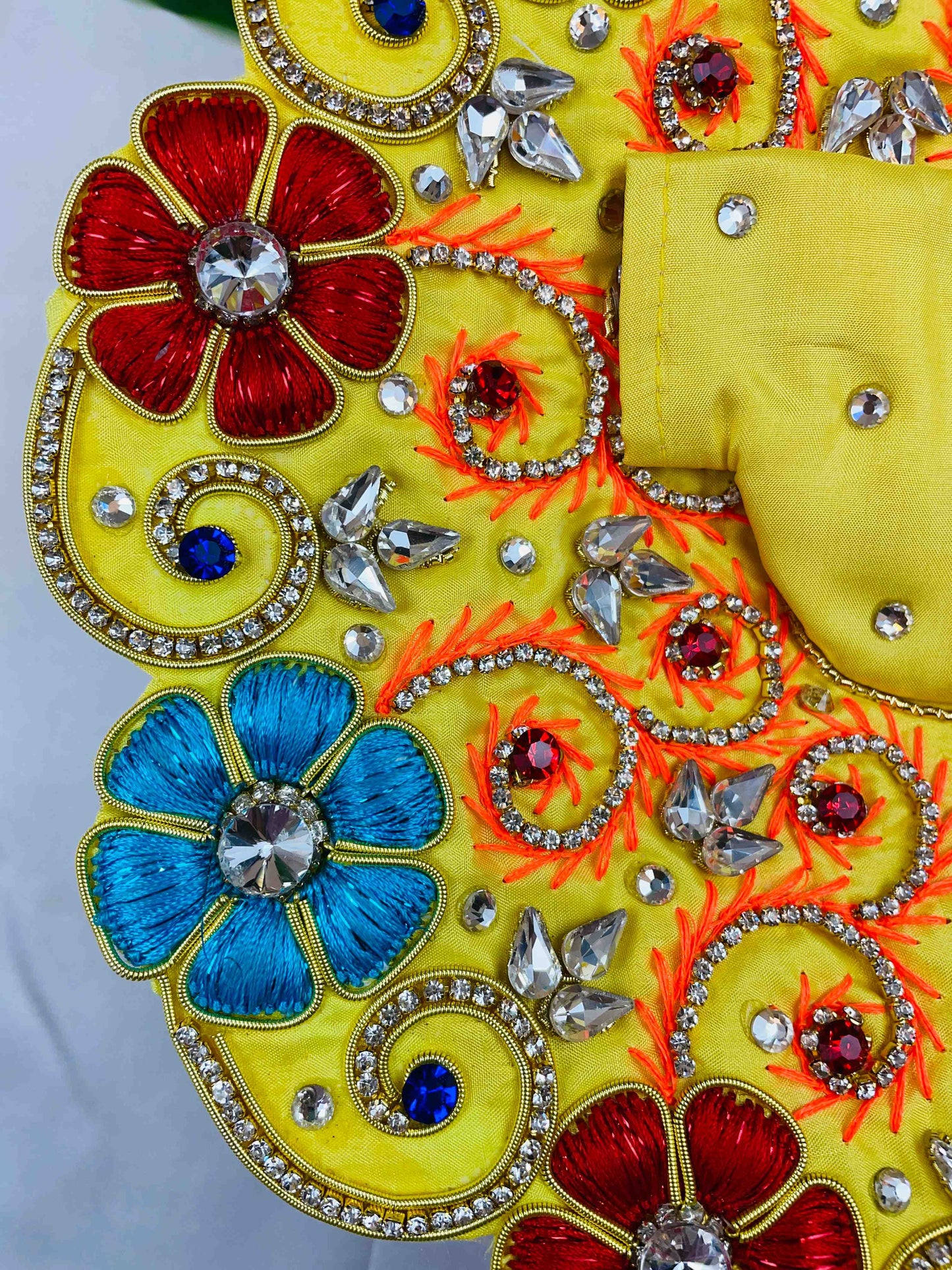 Yellow Laddu Gopal Dress with red and blue floral embroidery and sparkling stones – vibrant poshak for Kanha Ji.