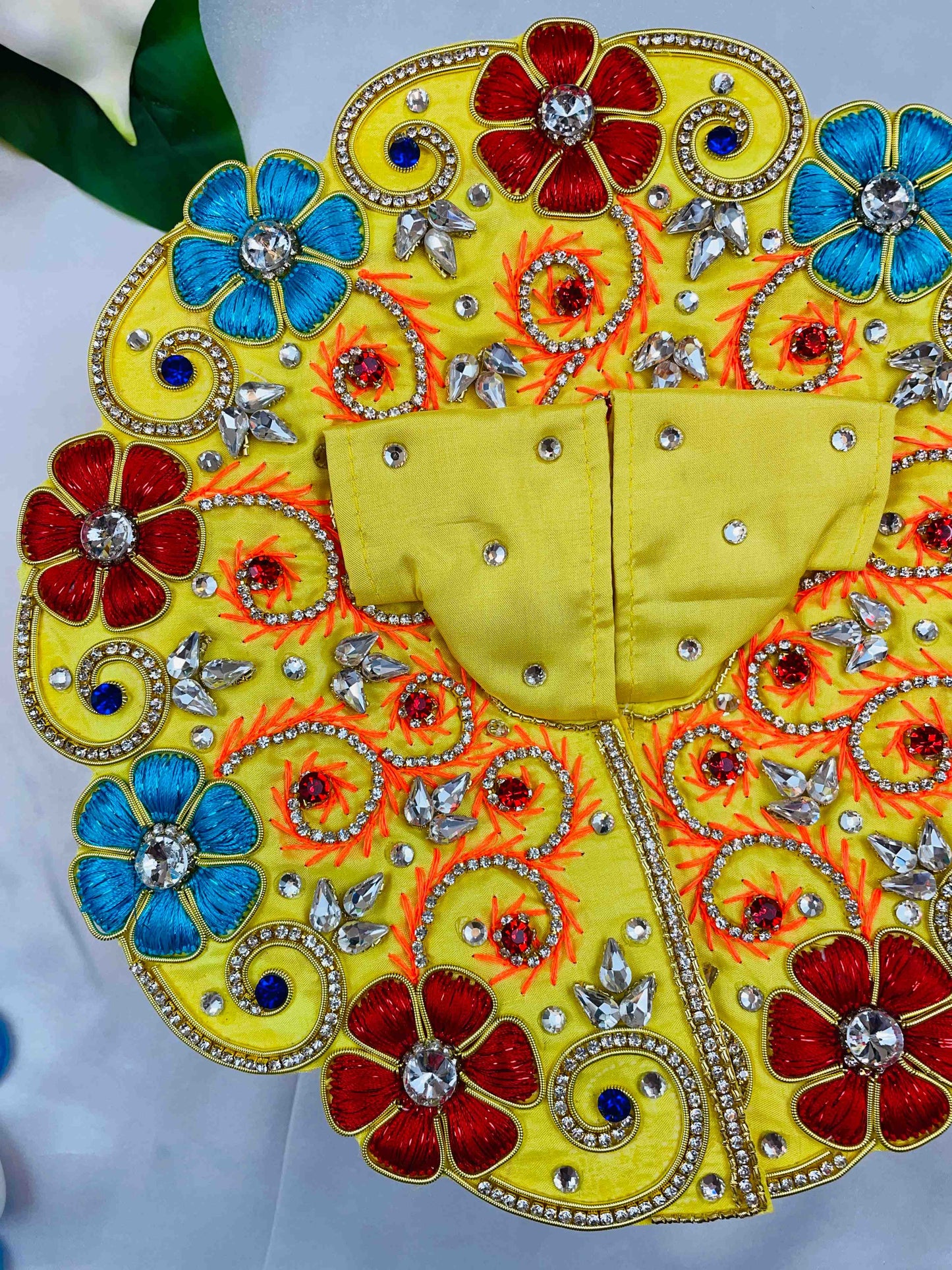 Yellow Laddu Gopal Dress with red and blue floral embroidery and sparkling stones – vibrant poshak for Kanha Ji.