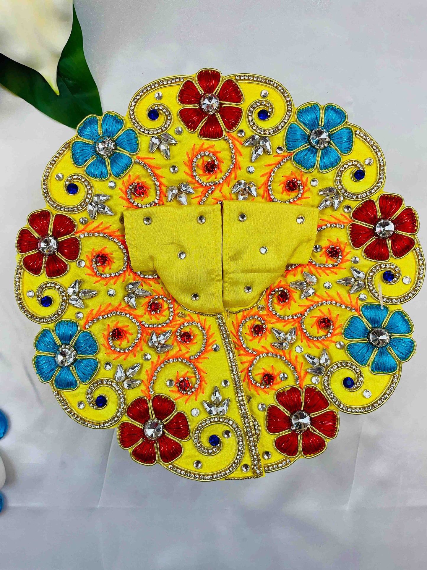 Yellow Laddu Gopal Dress with red and blue floral embroidery and sparkling stones – vibrant poshak for Kanha Ji.