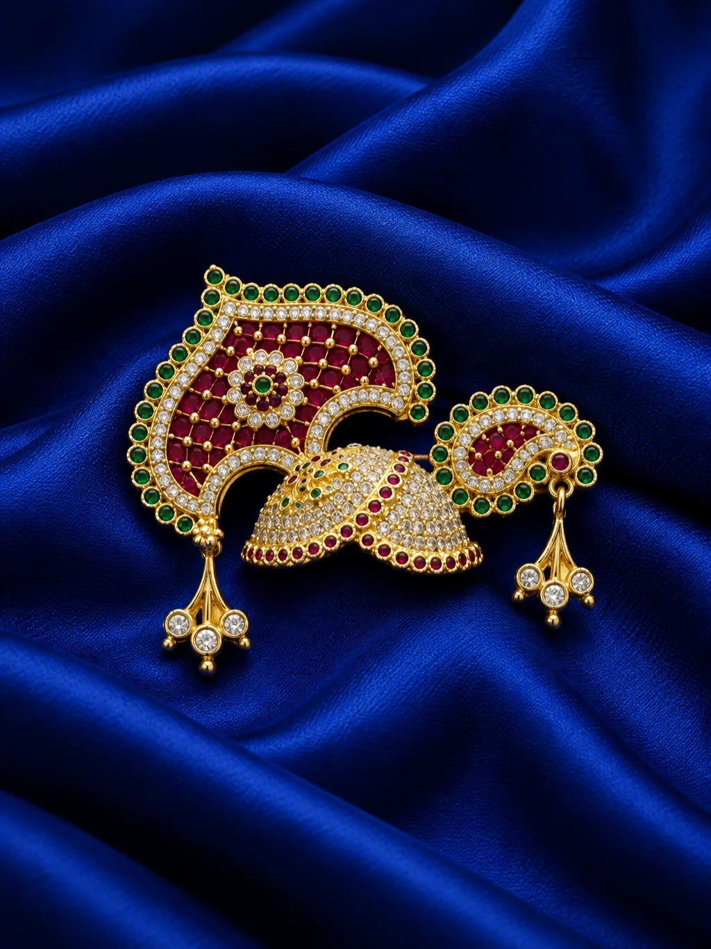 Manikya Panna Rajmahal AD Mukut for Deity featuring ruby-red and emerald-green inspired jewel detailing, royal palace-inspired ornamentation and sparkling American Diamond work for Laddu Gopal shringar.