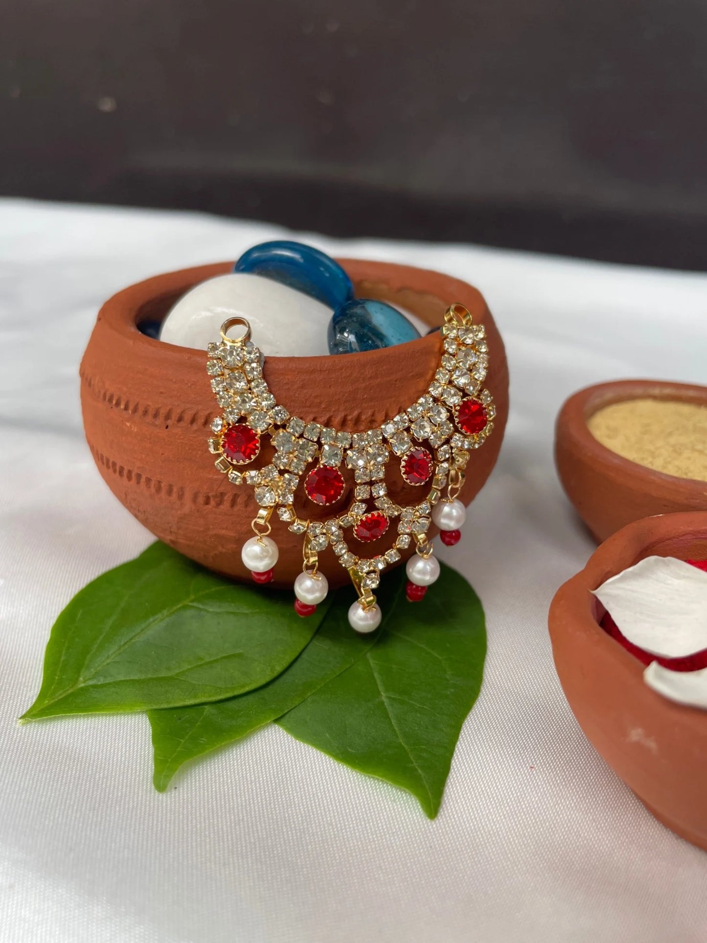 Laddu Gopal jewellery with red stones, pearl hangings, and diamond accents – divine necklace for Bal Gopal.
