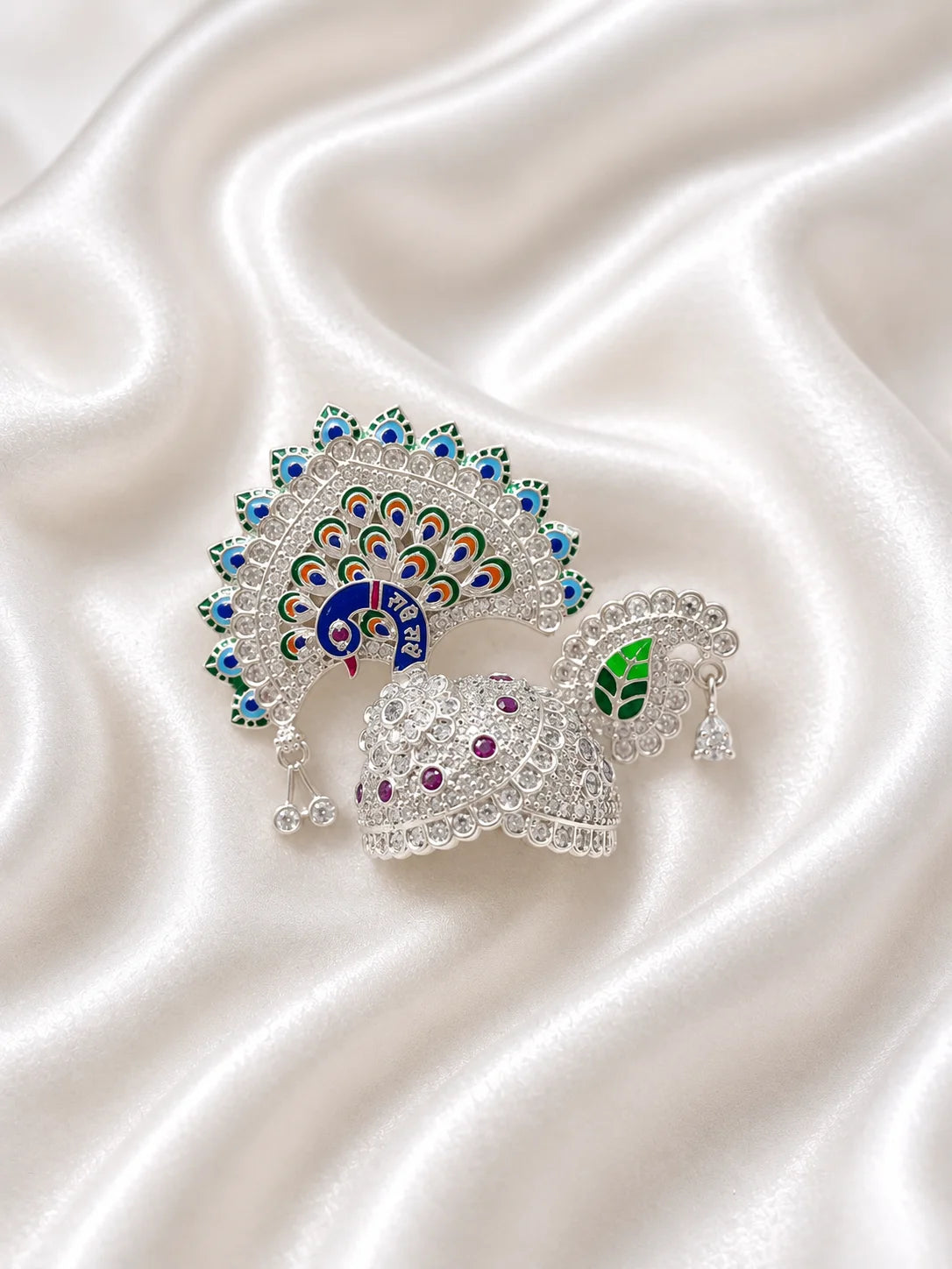 Silver color Peacock Utsav AD Mukut for Laddu Gopal with sparkling peacock-inspired AD design
