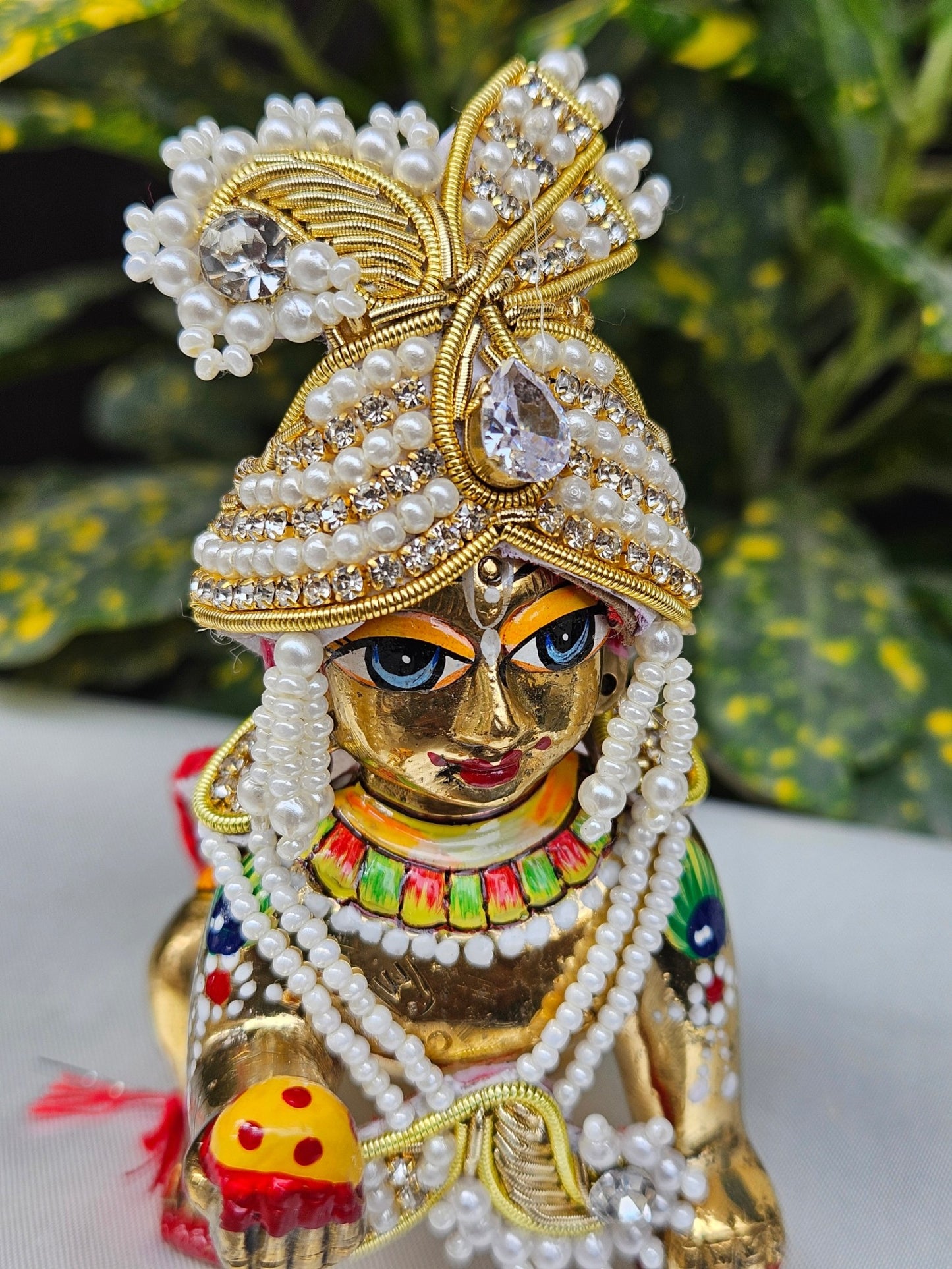 White pearl and gold Laddu Gopal jewellery set with mukut and mala – traditional shringar set for Kanha Ji.