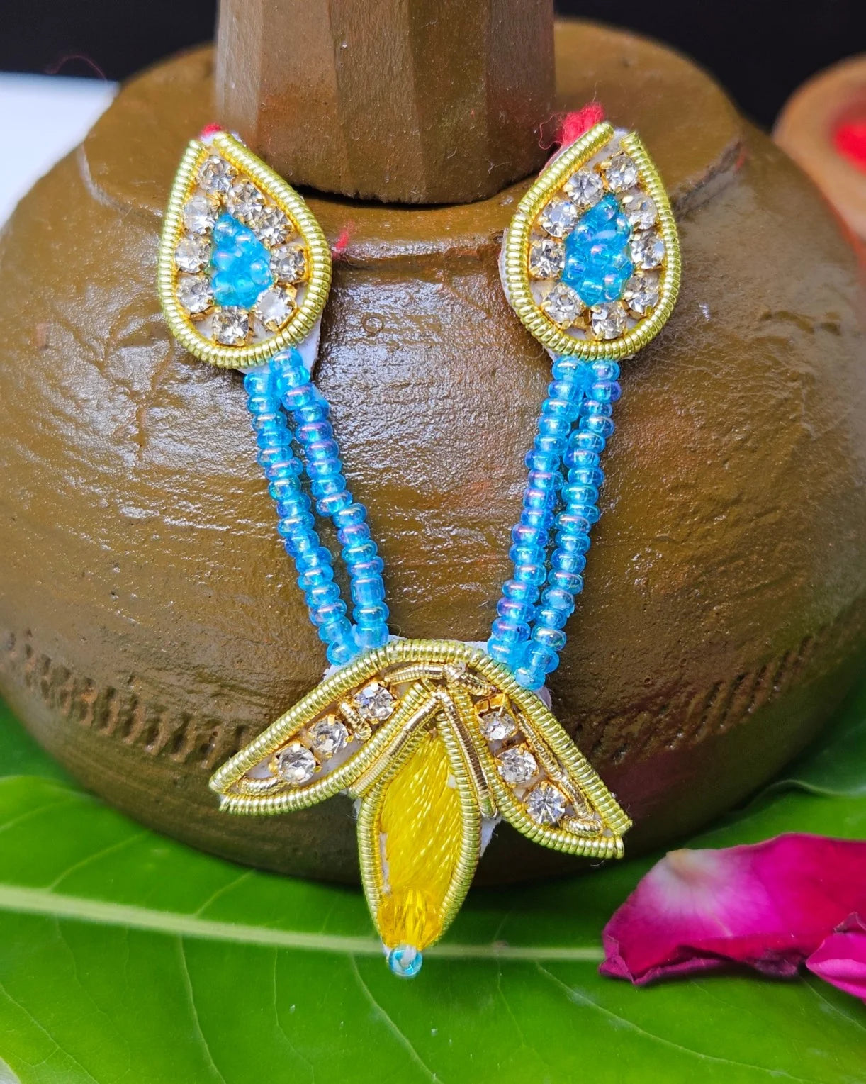 Laddu Gopal yellow and blue mukut with matching mala – handcrafted crown and necklace set for divine shringar.