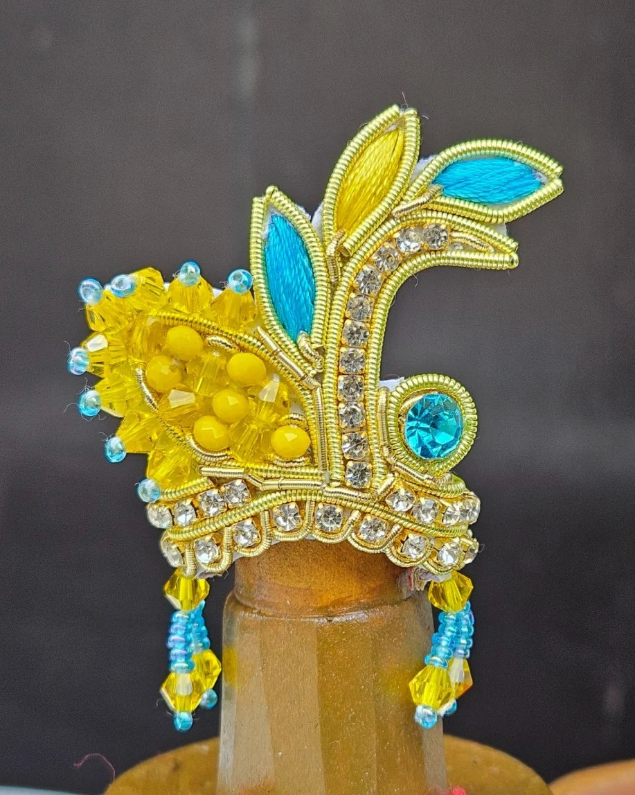 Laddu Gopal yellow and blue mukut with matching mala – handcrafted crown and necklace set for divine shringar.