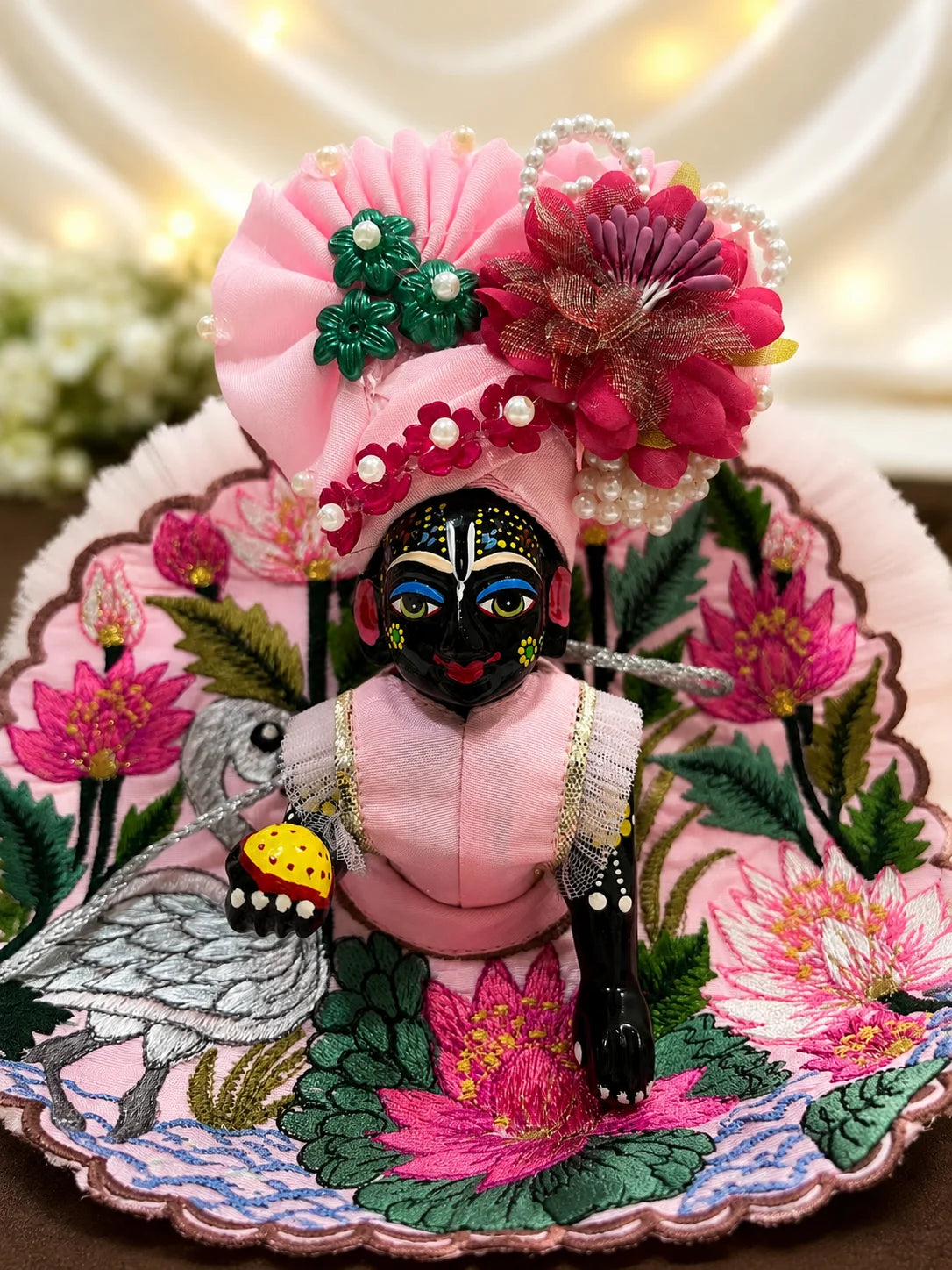 Blossom pink Kanha Ji dress featuring embroidered lotus and swan motifs with matching pink floral pagdi