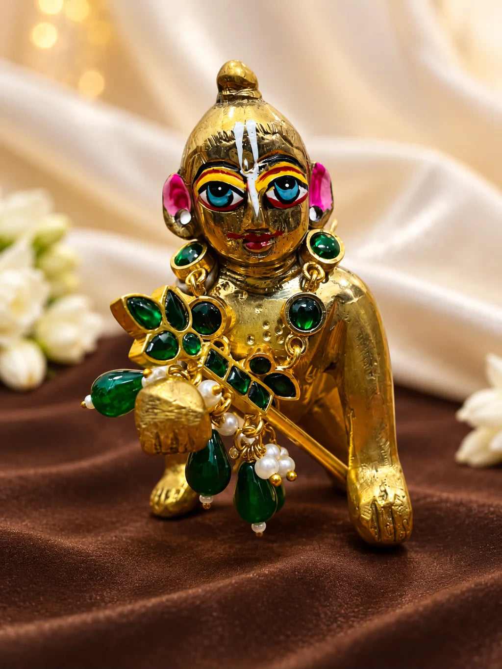 Harit Kusumika Necklace and Bansuri Set for Deity featuring green floral-inspired jewellery and a matching decorative Krishna flute for Laddu Gopal shringar
