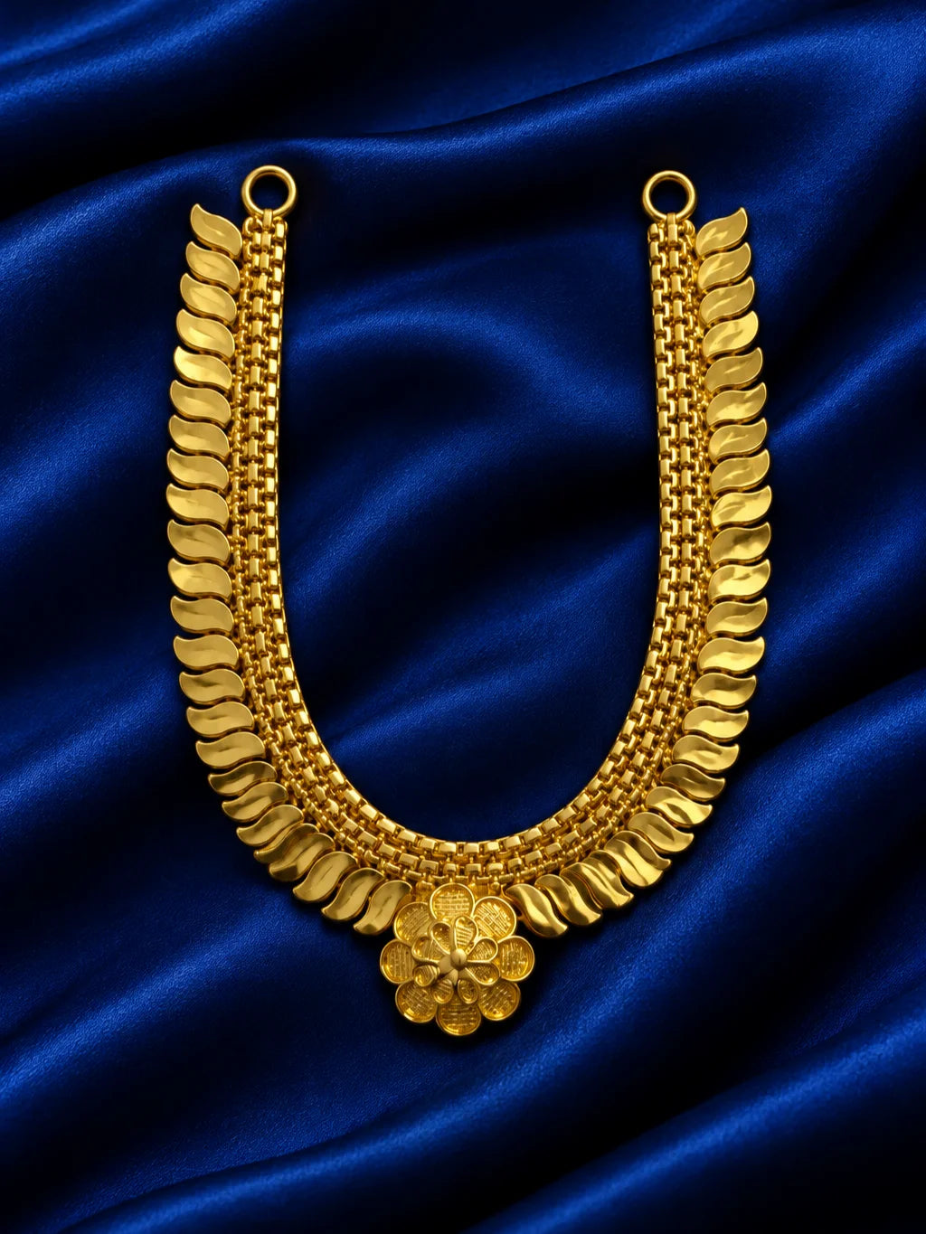 Kanak Pallav Gold Plated Haar for Deity featuring graceful leaf-inspired detailing and a rich golden finish. Ideal for Laddu Gopal and festive divine shringar.
