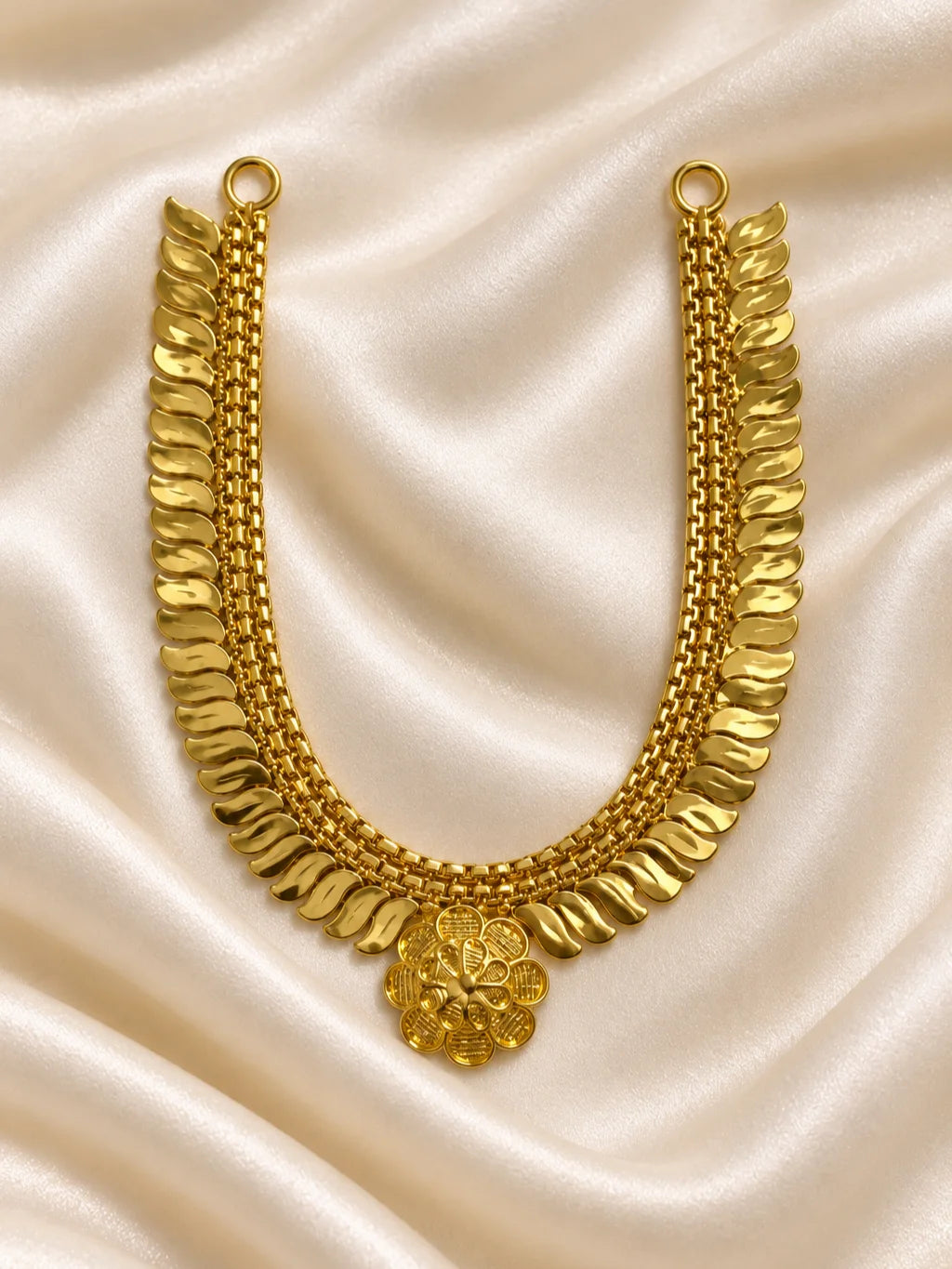 Kanak Pallav Gold Plated Haar for Deity featuring graceful leaf-inspired detailing and a rich golden finish. Ideal for Laddu Gopal and festive divine shringar.
