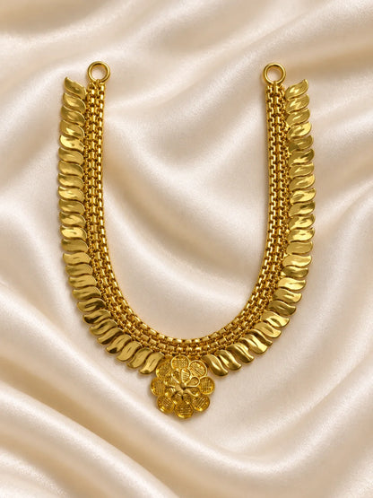 Kanak Pallav Gold Plated Haar for Deity featuring graceful leaf-inspired detailing and a rich golden finish. Ideal for Laddu Gopal and festive divine shringar.
