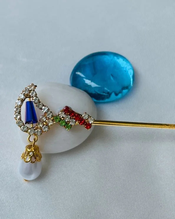 Laddu Gopal bansuri with multicolored crystals and blue stone, pearl hanging – elegant flute for Bal Gopal shringar.