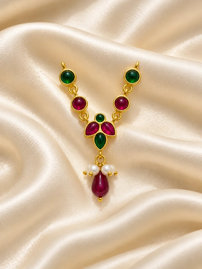 Manikya Panna Madhuri Necklace and Bansuri Set for Deity featuring ruby-red and emerald-green inspired jewellery styling with a matching decorative Krishna flute for Laddu Gopal shringar.
