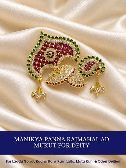 Manikya Panna Rajmahal AD Mukut for Deity featuring ruby-red and emerald-green inspired jewel detailing, royal palace-inspired ornamentation and sparkling American Diamond work for Laddu Gopal shringar.
