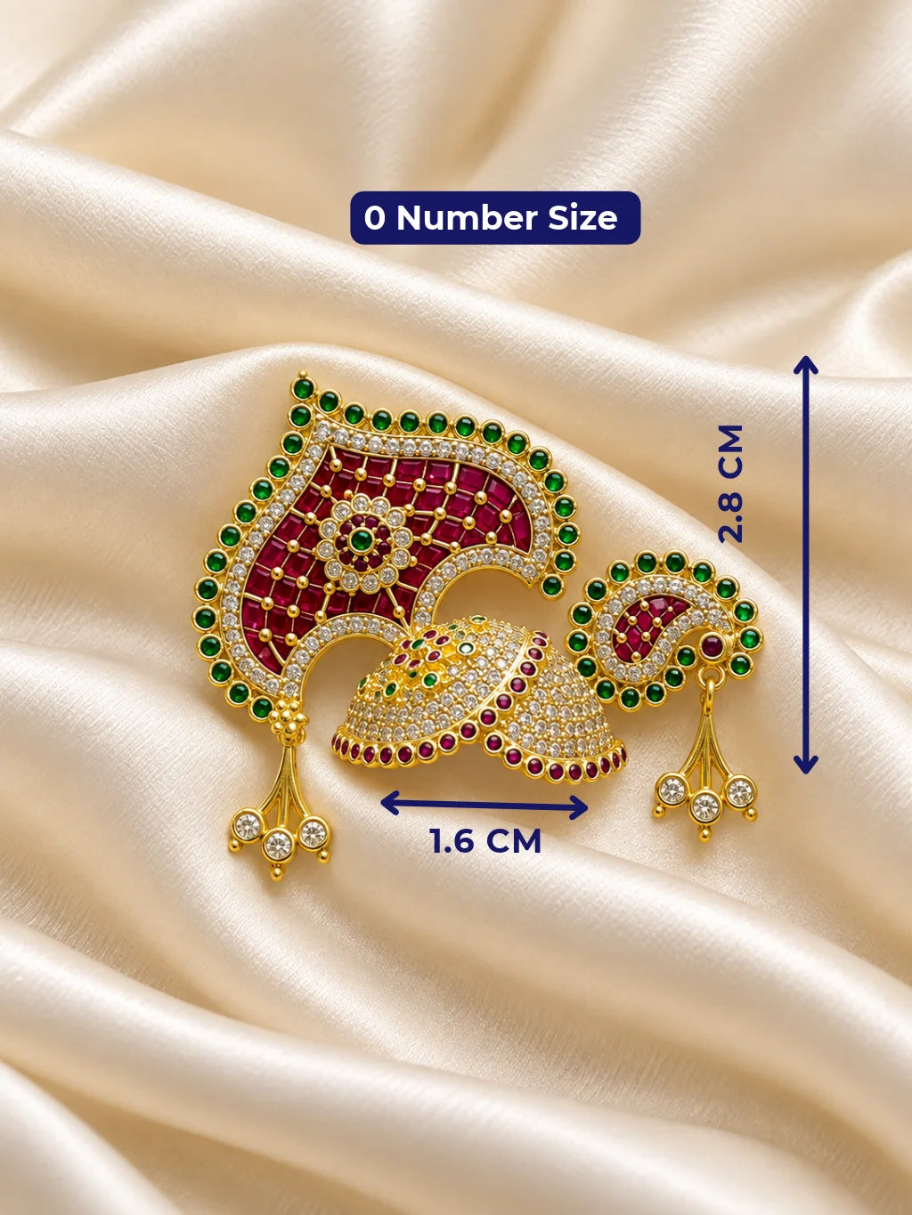 Manikya Panna Rajmahal AD Mukut for Deity featuring ruby-red and emerald-green inspired jewel detailing, royal palace-inspired ornamentation and sparkling American Diamond work for Laddu Gopal shringar.
