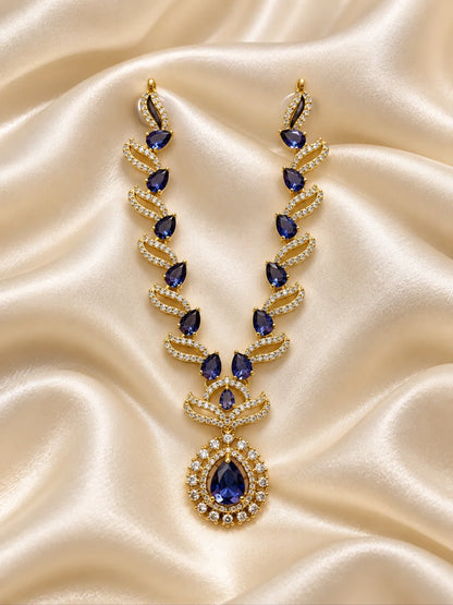 Manikya Tarang AD Necklace for Deity with ruby-inspired accents, flowing wave-style design and sparkling American Diamond detailing
