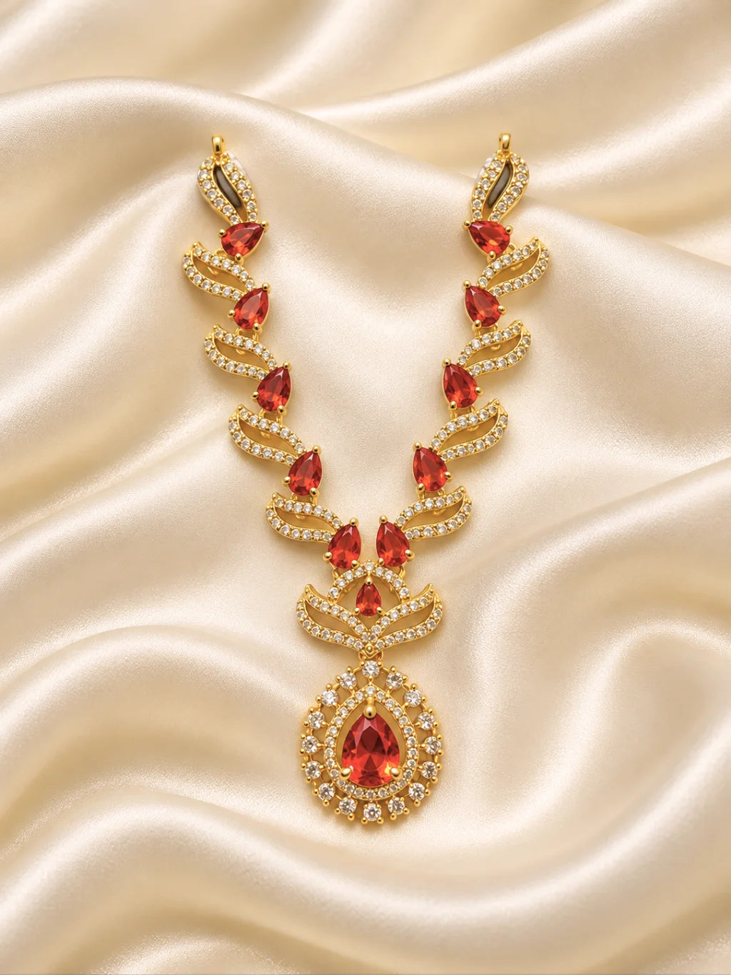 Manikya Tarang AD Necklace for Deity with ruby-inspired accents, flowing wave-style design and sparkling American Diamond detailing
