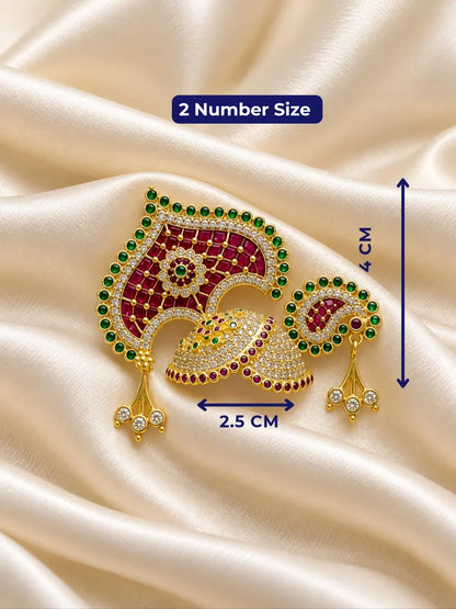 Manikya Panna Rajmahal AD Mukut for Deity featuring ruby-red and emerald-green inspired jewel detailing, royal palace-inspired ornamentation and sparkling American Diamond work for Laddu Gopal shringar.
