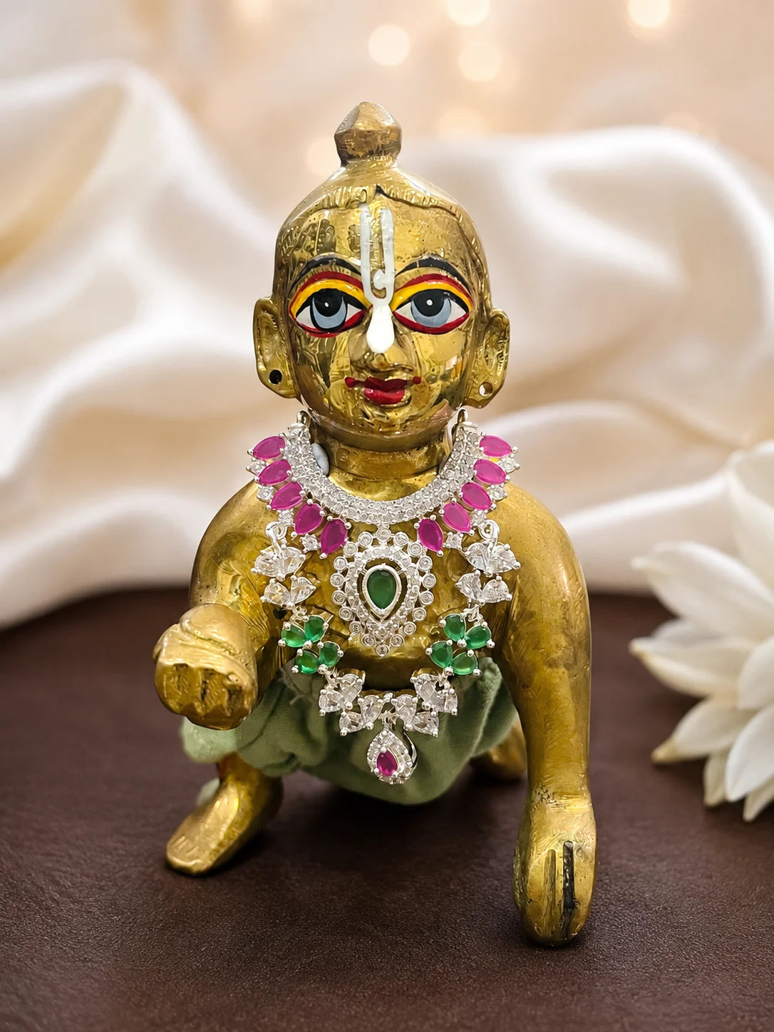 Maniratna AD Necklace for deity with sparkling American Diamond stones and royal gem-inspired detailing