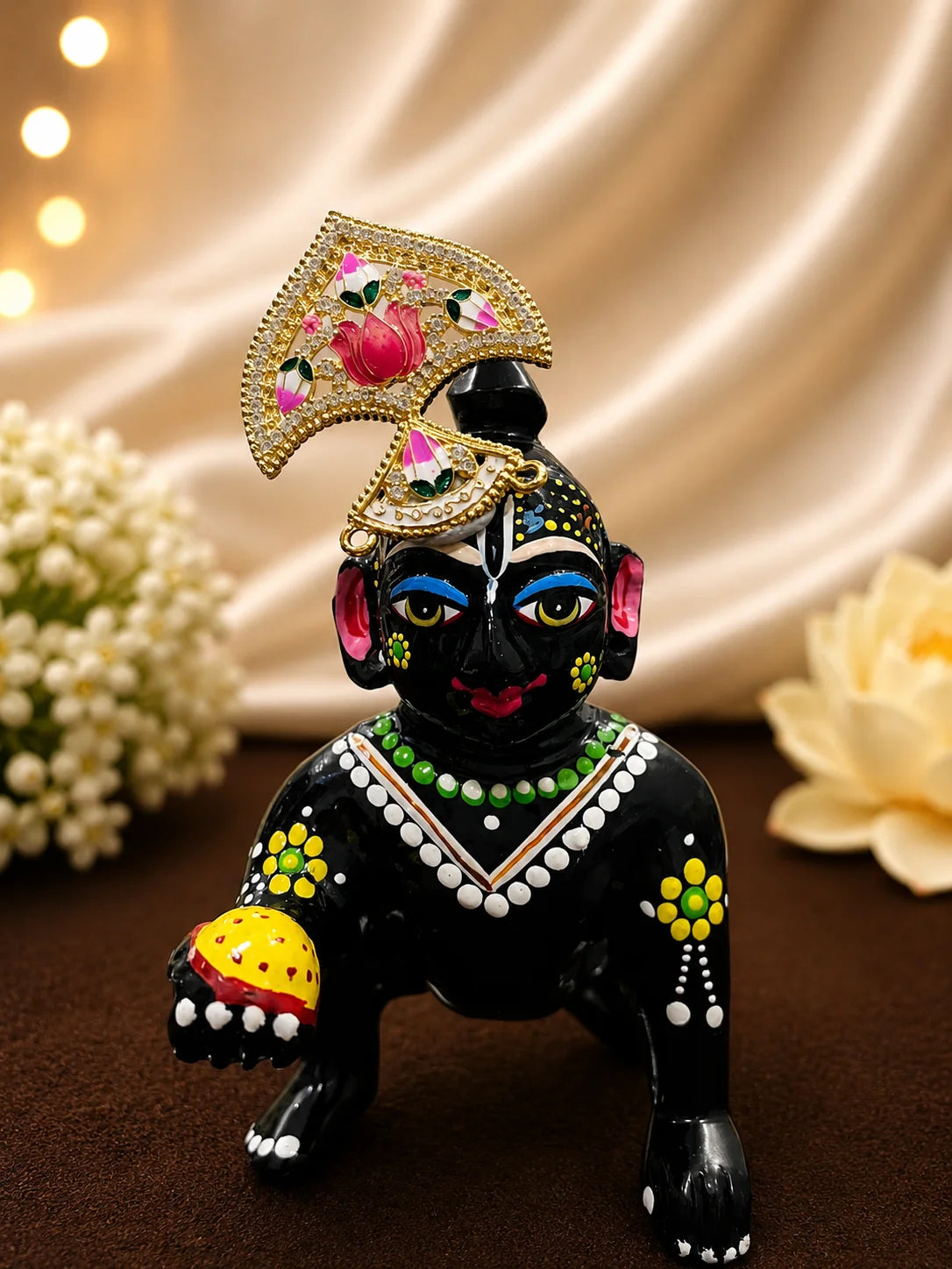 Black brass Bal Gopal Laddu Gopal idol adorned with a designer gold-plated pink lotus Meenakari diamond seep mukut crown