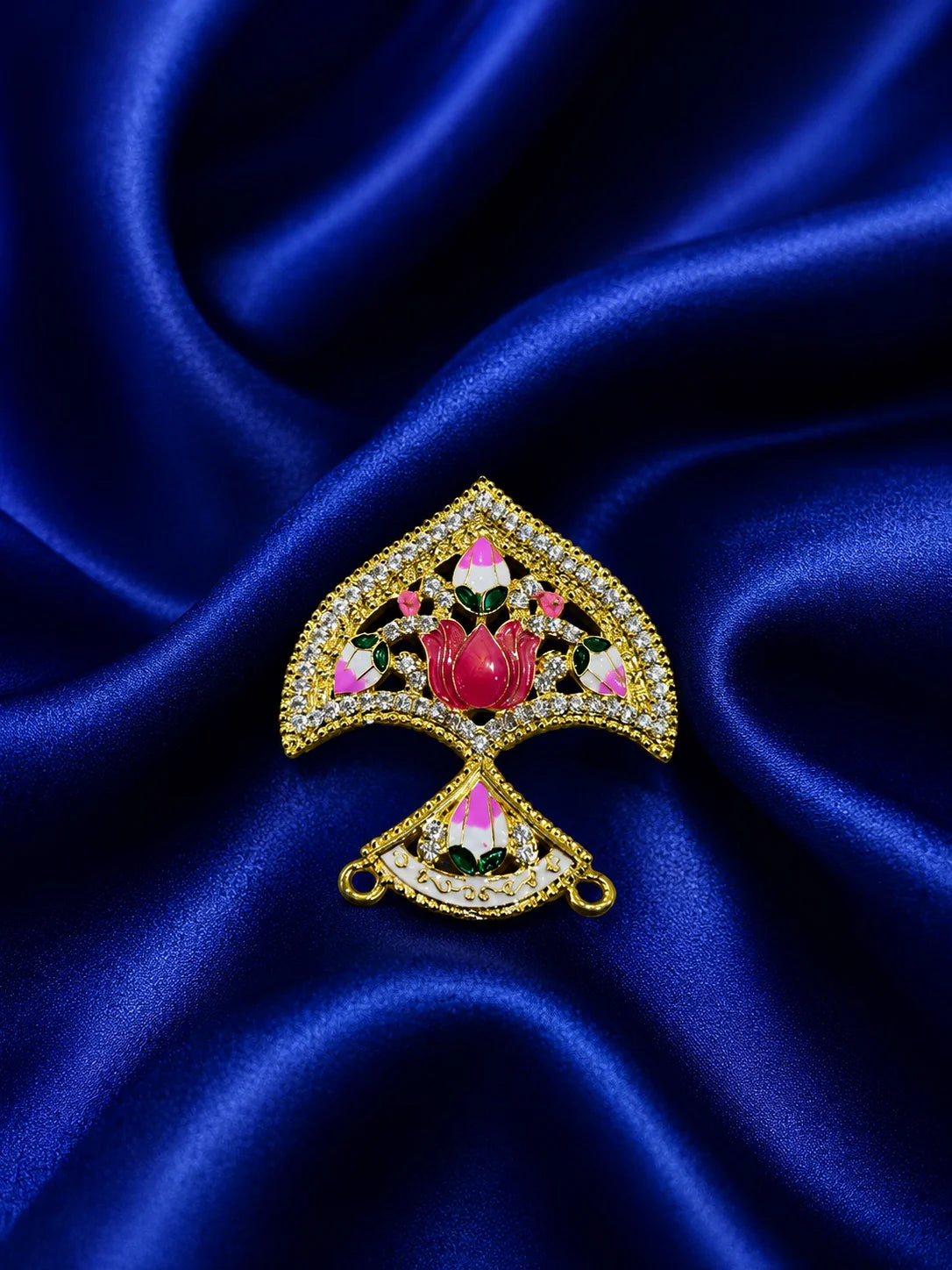 Gold plated traditional seep shaped deity crown embedded with white American diamonds and pink lotus Meenakari work on a rich navy blue satin background