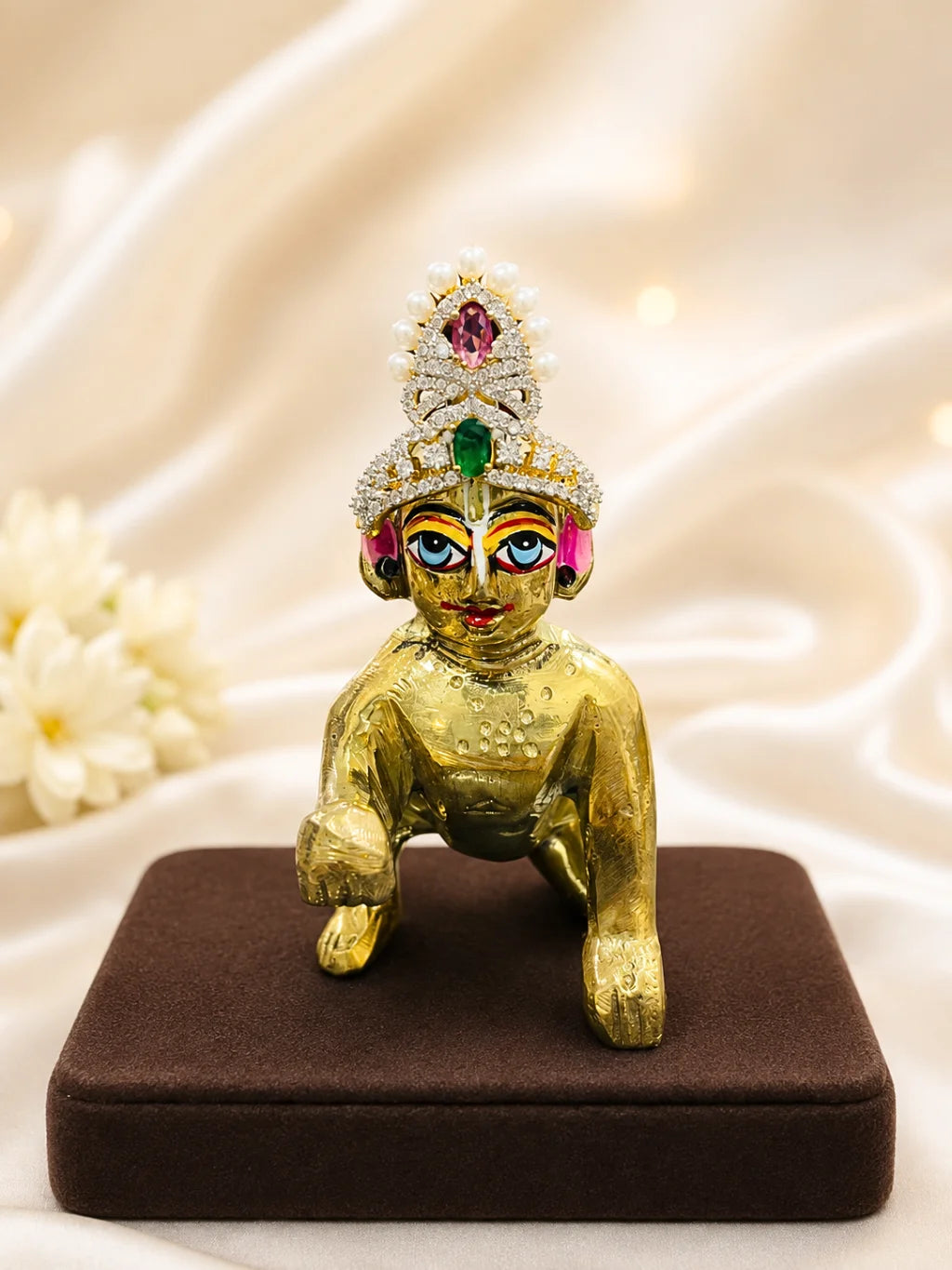 Moti Kanti AD Mukut for Deity, adorned with elegant pearls and sparkling silver-tone AD stones for festive, temple and daily shringar.
