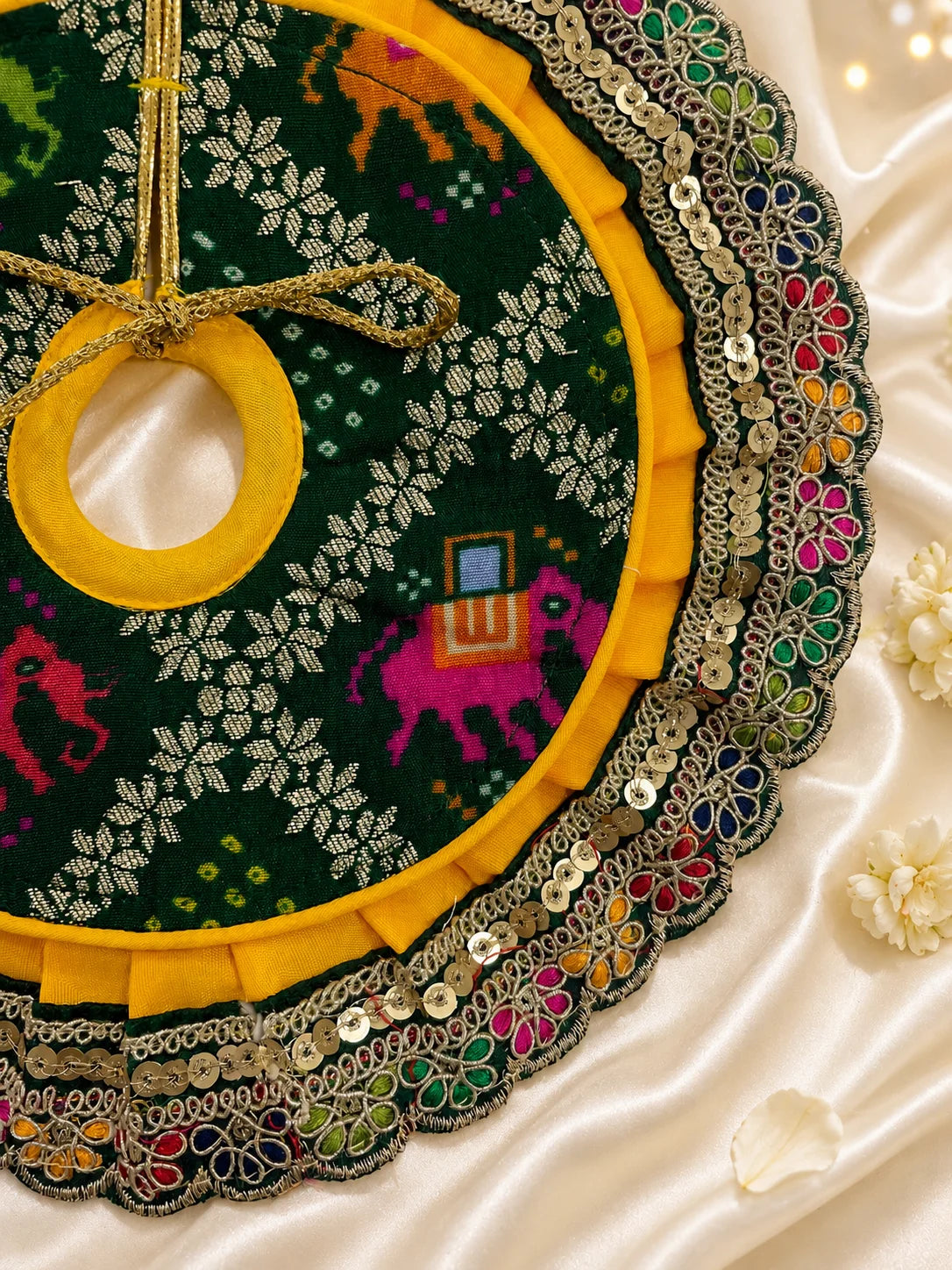 Traditional Green and Yellow Patola Print Laddu Gopal Poshak Set with Sequin Lace Border Flatlay