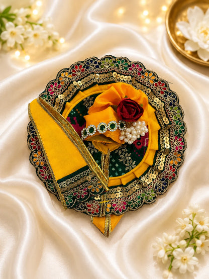 Traditional Green and Yellow Patola Print Laddu Gopal Poshak Set with Sequin Lace Border Flatlay