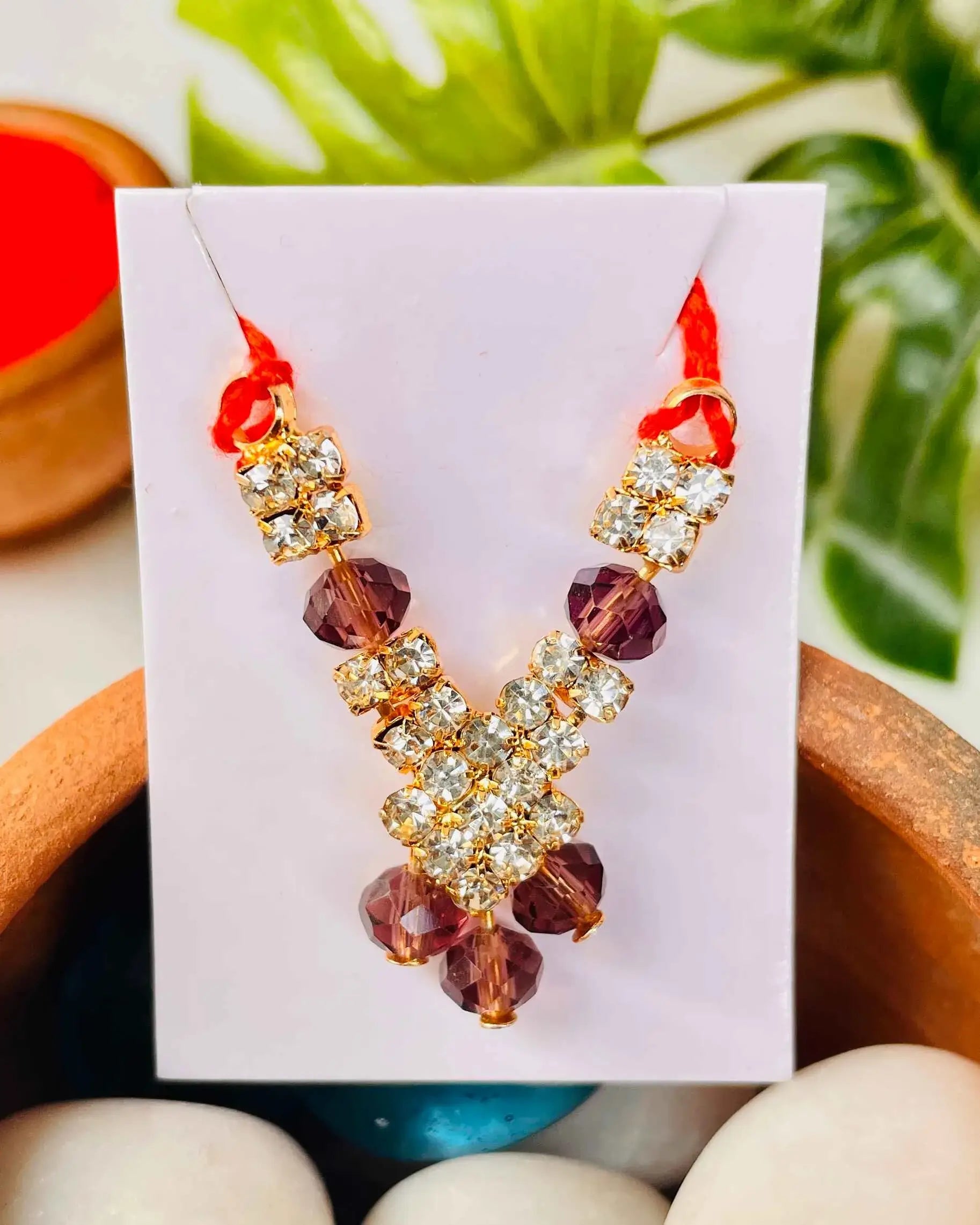 Laddu Gopal jewellery with golden stones and purple crystal beads for Kanha Ji.
