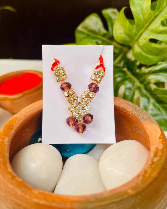 Laddu Gopal jewellery with golden stones and purple crystal beads for Kanha Ji.