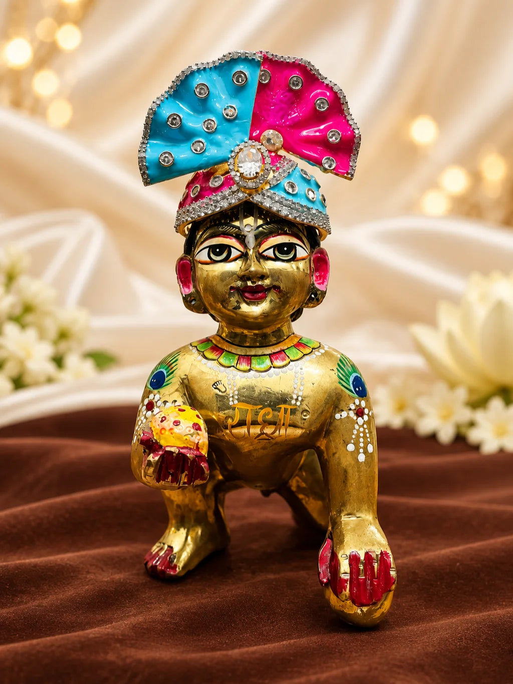 Shop Rang Mahal AD Mukut for Deity with vibrant royal-inspired artistry and sparkling AD work. A beautiful crown for Laddu Gopal and festive shringar.
