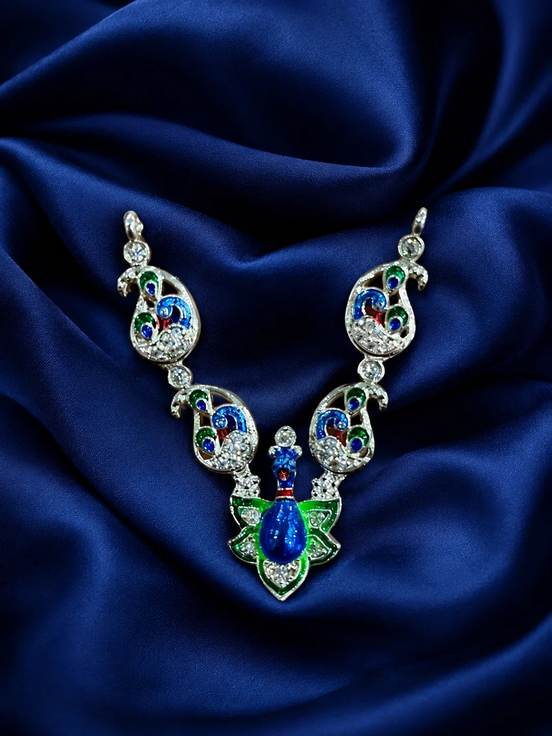 Premium crystal-embedded Meenakari peacock haar for Laddu Gopal Ji on dark blue silk background