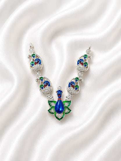 Sacred silver finish blue and green Meenakari peacock necklace for deity shringar on white fabric