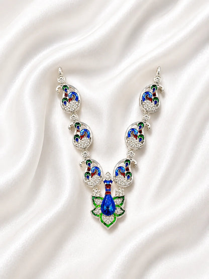 Sacred silver finish blue and green Meenakari peacock necklace for deity shringar on white fabric