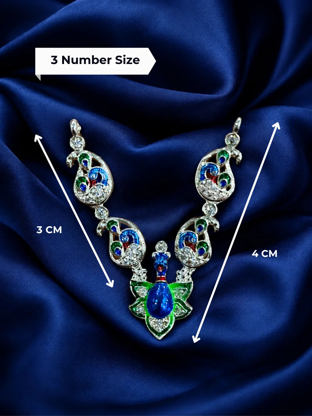 Premium crystal-embedded Meenakari peacock haar for Laddu Gopal Ji on dark blue silk background