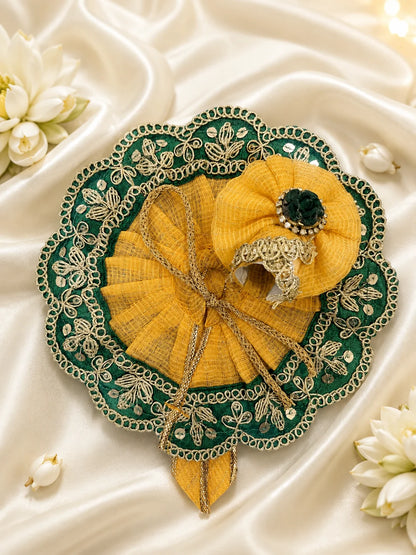 Close Up of Emerald Green Scalloped Metallic Zari Lace and Sequins on Yellow Textured Laddu Gopal Dress

