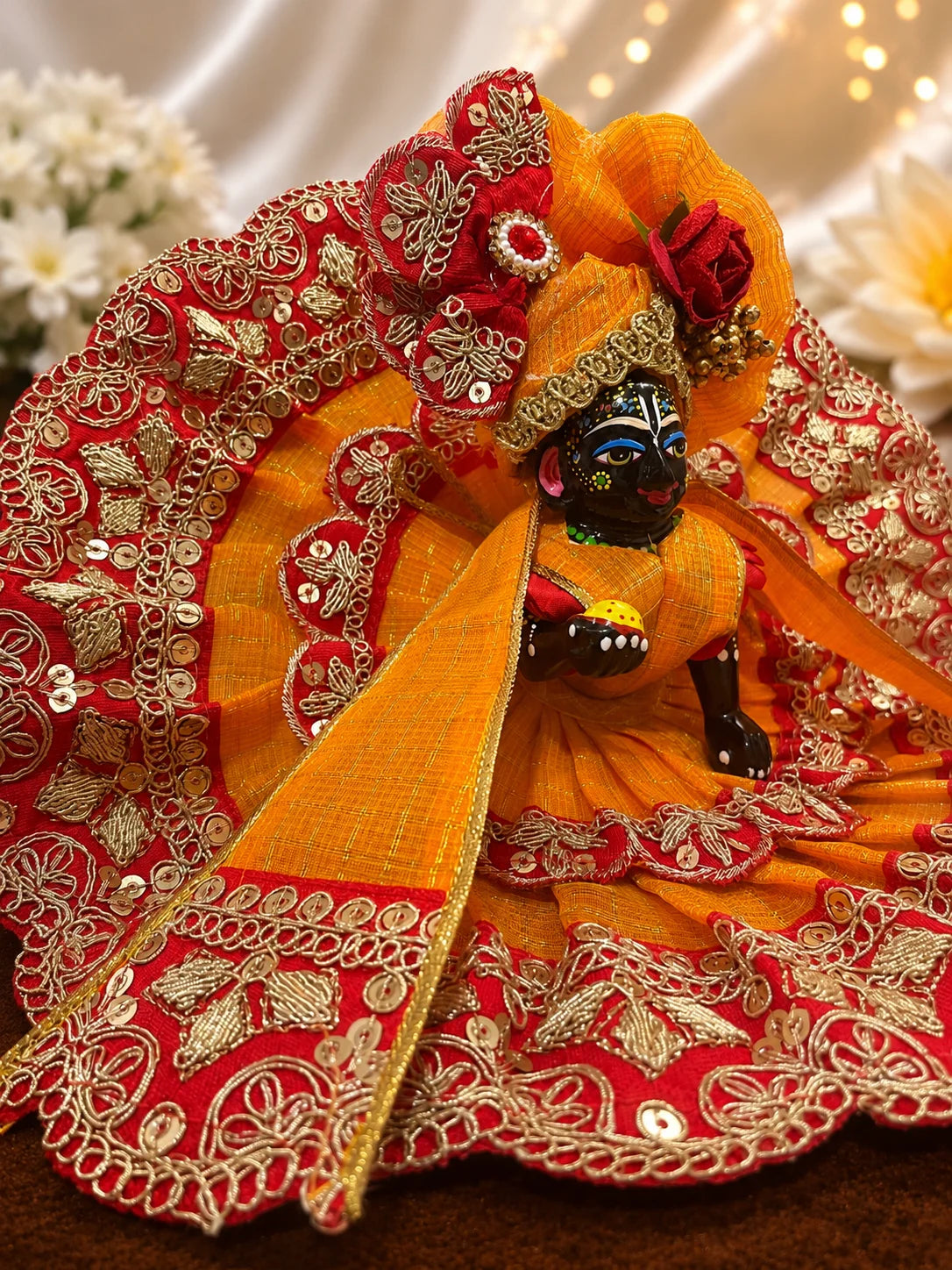 Deity Wearing Regal Green and Yellow Scalloped Zari Border Laddu Gopal Poshak with Heavy Rose Flower Pagdi