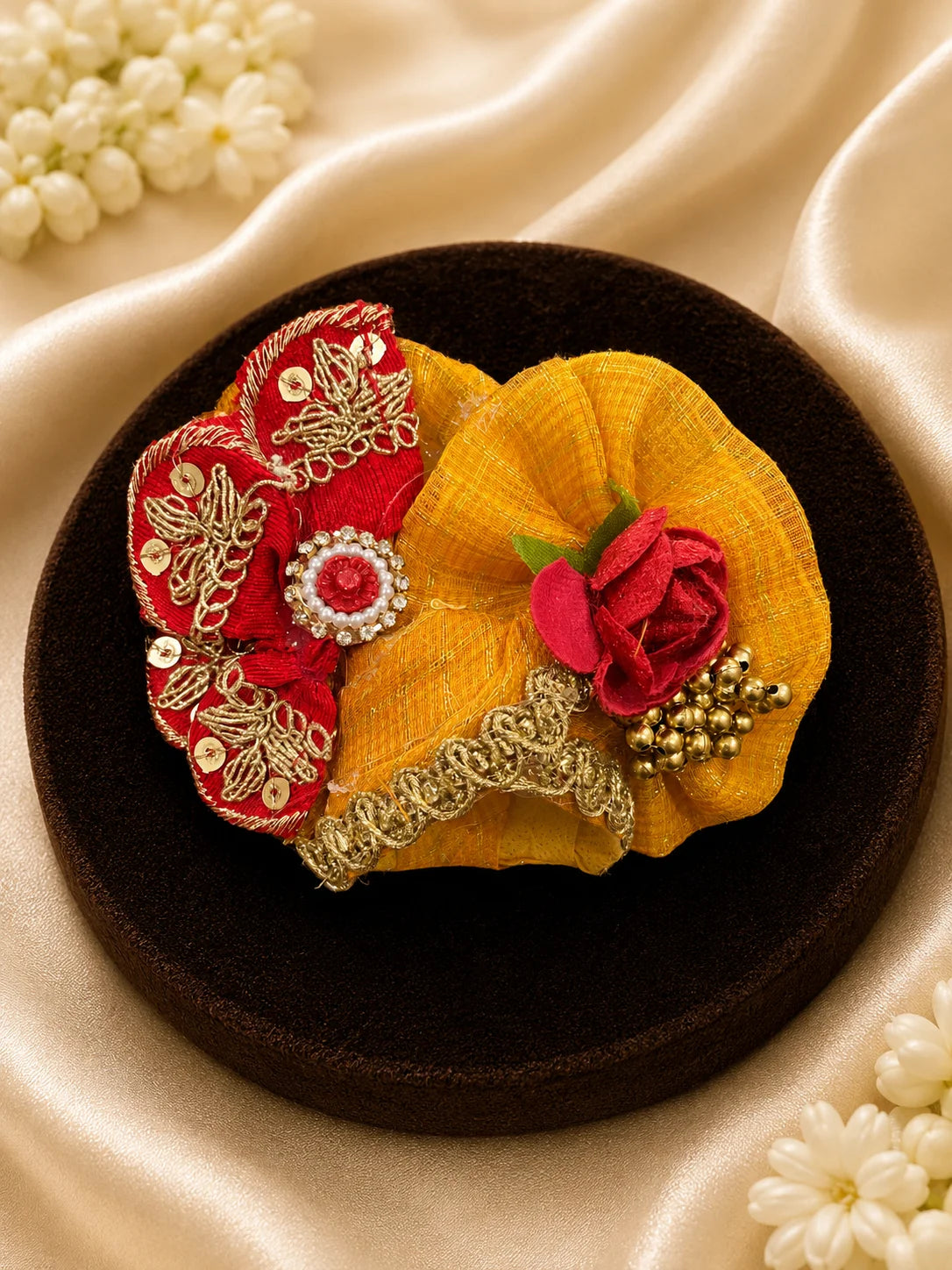 Close Up of Emerald Green Scalloped Metallic Zari Lace and Sequins on Yellow Textured Laddu Gopal Dress

