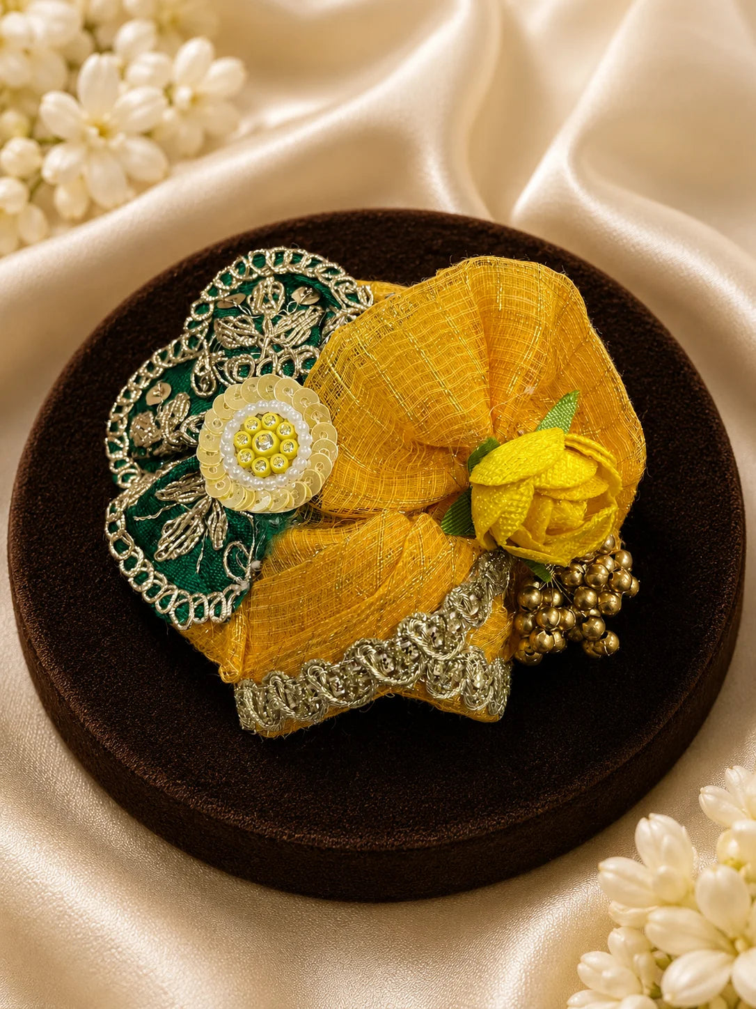 Close Up of Emerald Green Scalloped Metallic Zari Lace and Sequins on Yellow Textured Laddu Gopal Dress

