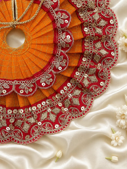 Close Up of Emerald Green Scalloped Metallic Zari Lace and Sequins on Yellow Textured Laddu Gopal Dress

