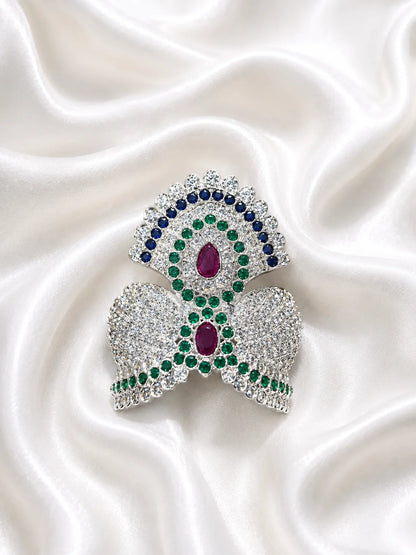 Black brass Laddu Gopal idol adorned with a majestic all-white sparkling diamond silver crown against a soft gold background